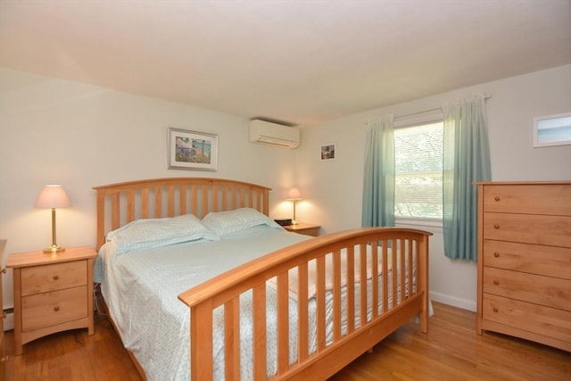13 N Grove St, Foxboro, MA 02035 - bedroom with a wall mounted AC and wood finished floors