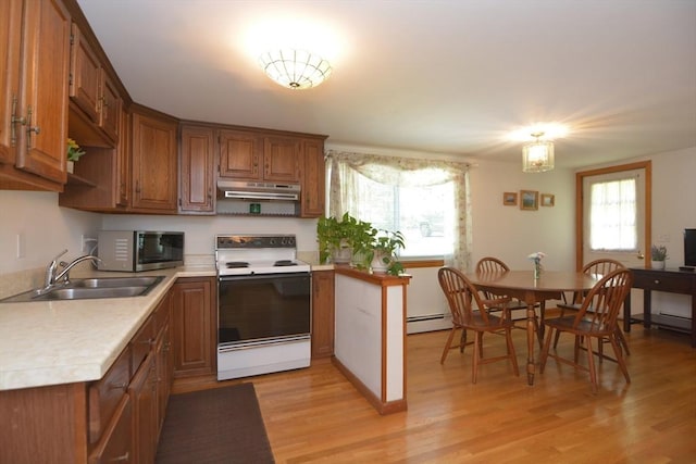 13 N Grove St, Foxboro, MA 02035 - kitchen with white range with electric cooktop, stainless steel microwave, under cabinet range hood, a baseboard heating unit, and brown cabinets