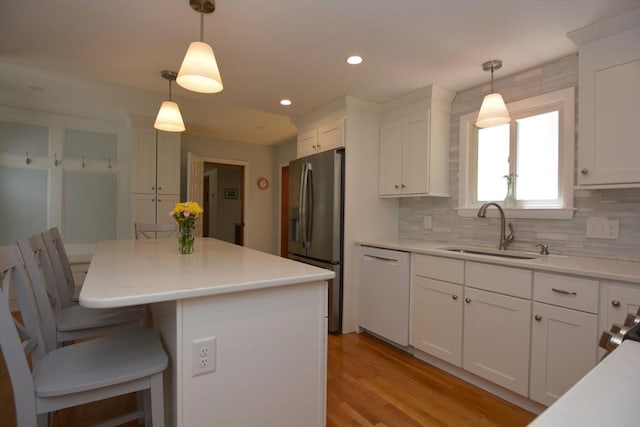 13 N Grove St, Foxboro, MA 02035 - kitchen with dishwasher, stainless steel fridge, white cabinets, decorative backsplash, and recessed lighting