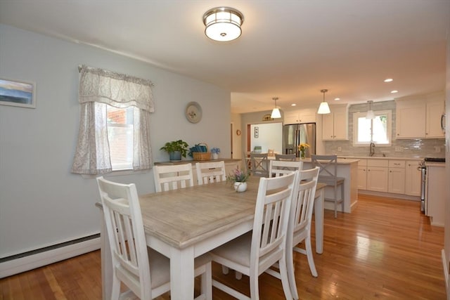 13 N Grove St, Foxboro, MA 02035 - dining area with a baseboard heating unit, light wood-style flooring, and recessed lighting
