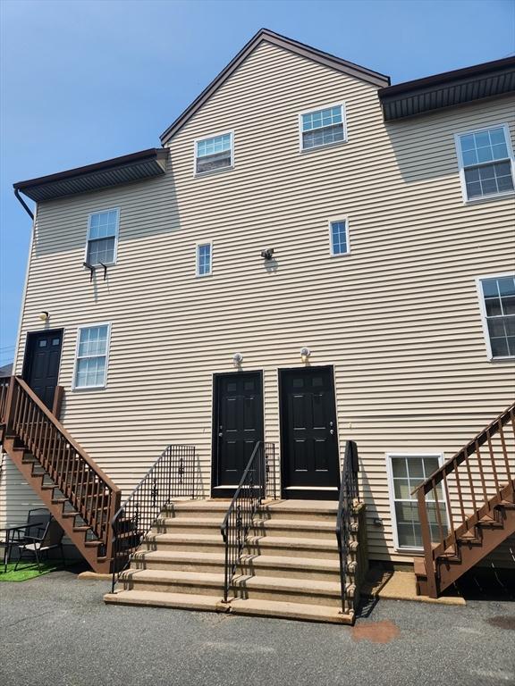 147 Stafford Rd, Fall River, MA 02721 - rear view of house featuring stairway