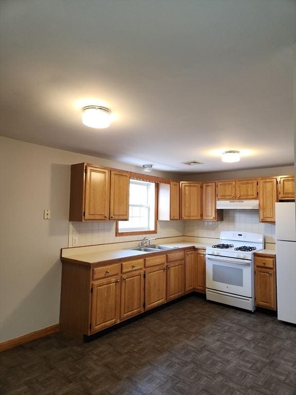 147 Stafford Rd, Fall River, MA 02721 - kitchen featuring under cabinet range hood, white appliances, light countertops, and decorative backsplash