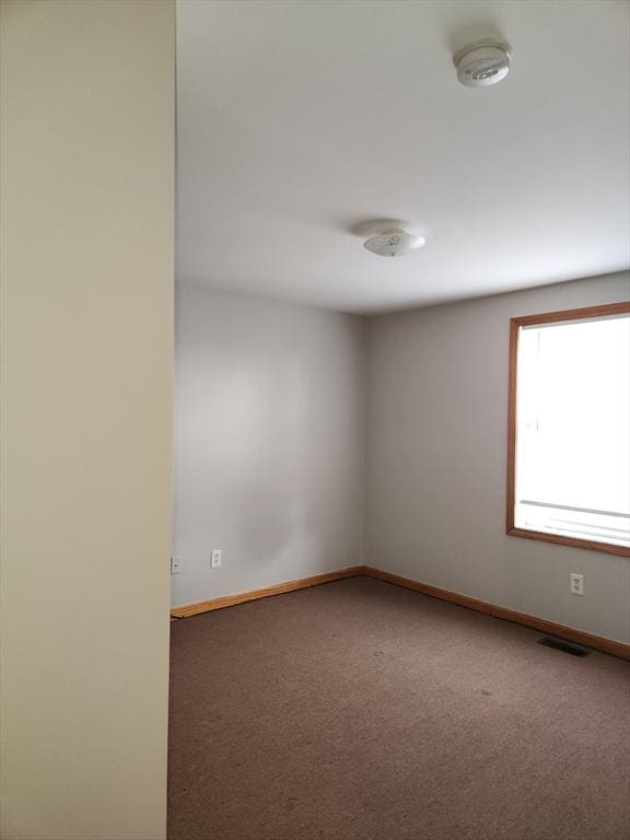 147 Stafford Rd, Fall River, MA 02721 - spare room featuring a smoke detector and carpet floors