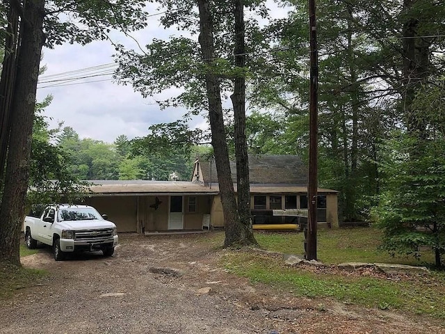 24 Cote Ln, Sutton, MA 01590 - view of front of house with dirt driveway