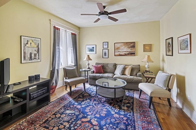 living room with hardwood / wood-style floors and ceiling fan