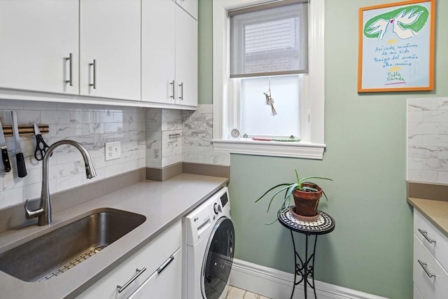 laundry room with washer / clothes dryer, sink, and cabinets