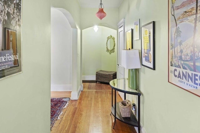 hallway with light hardwood / wood-style flooring