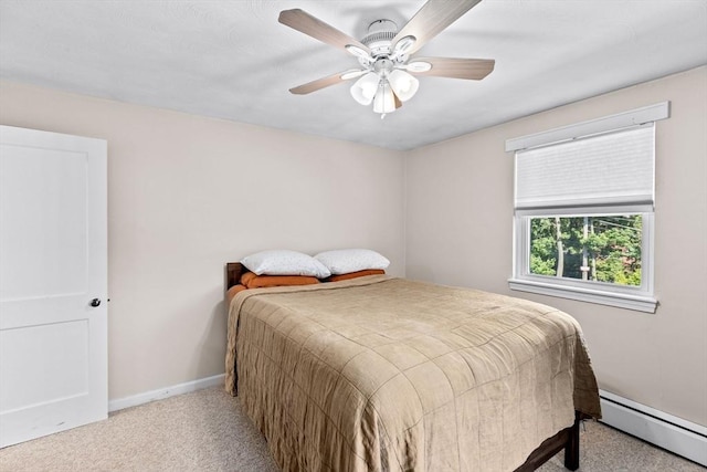 carpeted bedroom featuring baseboards, a baseboard heating unit, and ceiling fan