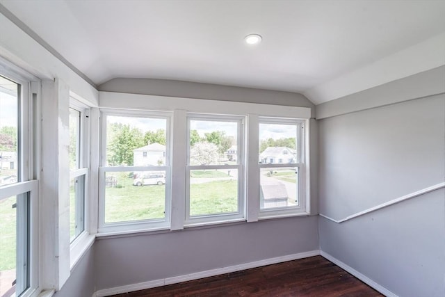 unfurnished sunroom with lofted ceiling
