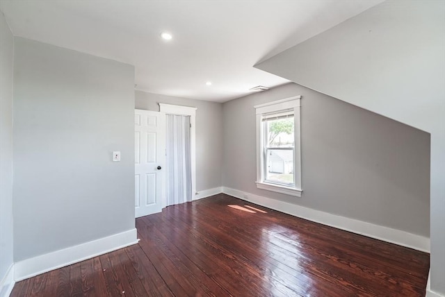 bonus room featuring baseboards, hardwood / wood-style floors, and recessed lighting