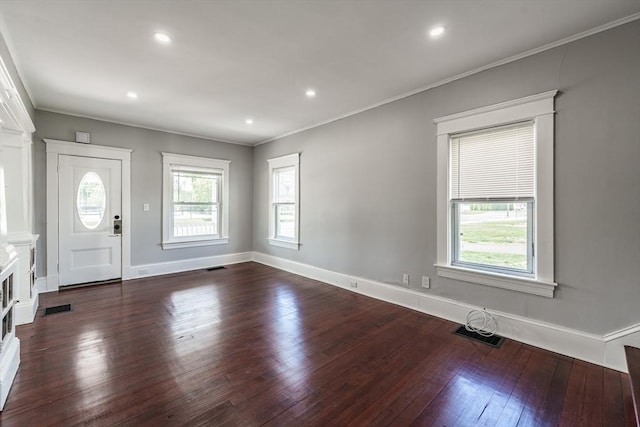 entryway featuring dark wood-style floors, crown molding, baseboards, and recessed lighting