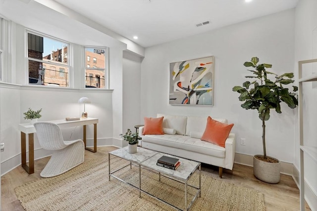 sitting room featuring light hardwood / wood-style flooring