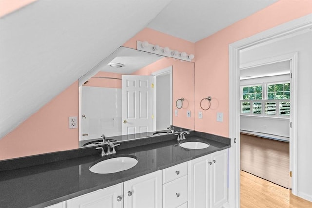 6 Kendall Vlg Unit 6, Cohasset, MA 02025 - full bathroom with a baseboard heating unit, double vanity, and wood finished floors