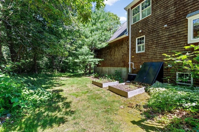 6 Kendall Vlg Unit 6, Cohasset, MA 02025 - view of green lawn featuring a vegetable garden