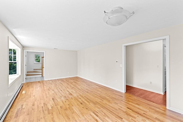 6 Kendall Vlg Unit 6, Cohasset, MA 02025 - unfurnished room with baseboard heating and light wood-style floors