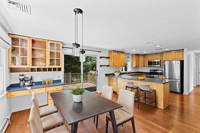 6 Kendall Vlg Unit 6, Cohasset, MA 02025 - dining room with a baseboard radiator, wood finished floors, and recessed lighting