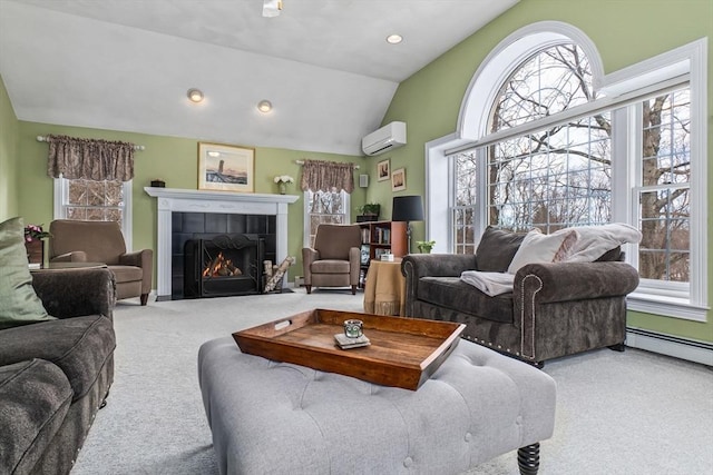 living room with plenty of natural light, carpet, and a tiled fireplace