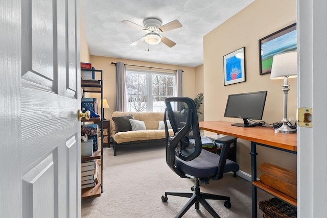 office area with ceiling fan and carpet floors