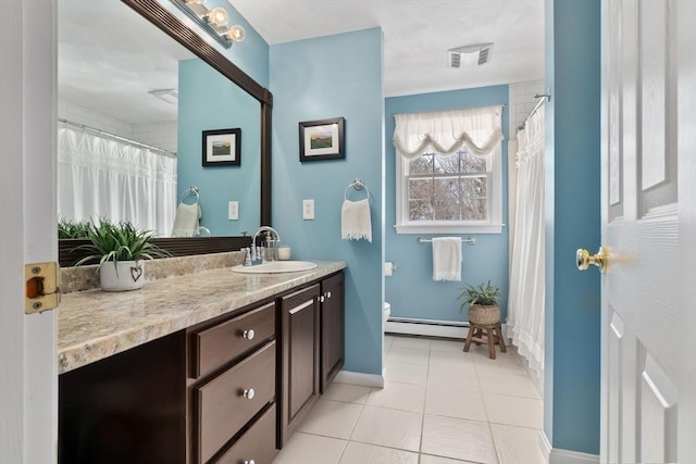 full bath with visible vents, toilet, tile patterned floors, vanity, and a baseboard heating unit