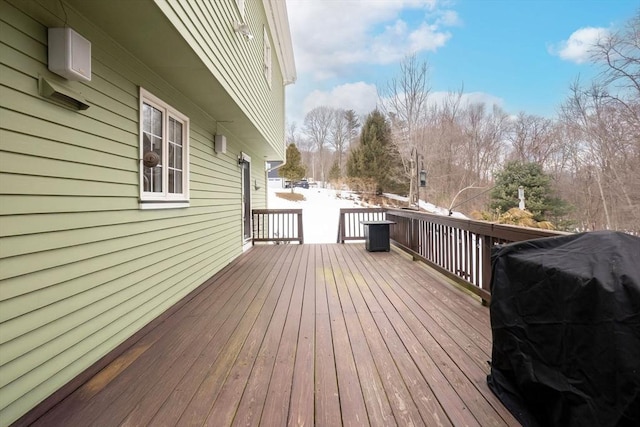 wooden terrace featuring area for grilling