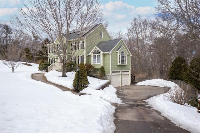 view of front of property with driveway and a garage