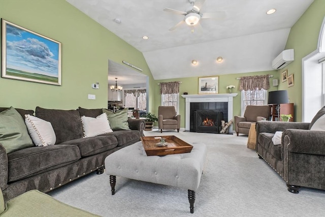 carpeted living area featuring recessed lighting, ceiling fan with notable chandelier, a fireplace, vaulted ceiling, and a wall mounted air conditioner