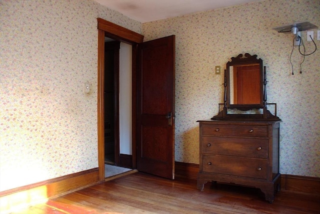 142 College St, Worcester, MA 01610 - bedroom with wallpapered walls and wood finished floors