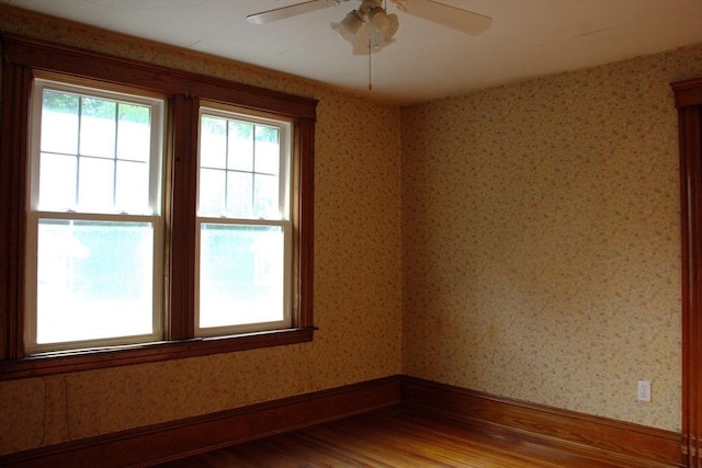 142 College St, Worcester, MA 01610 - empty room featuring wood finished floors, ceiling fan, and wallpapered walls