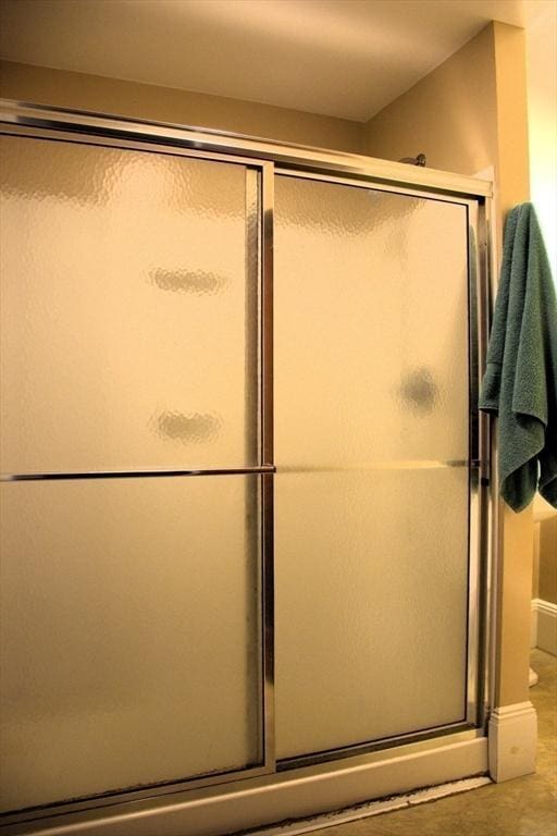 142 College St, Worcester, MA 01610 - full bath with a shower stall and baseboards