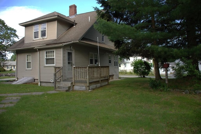 142 College St, Worcester, MA 01610 - rear view of house with a deck, a yard, a shingled roof, and a chimney