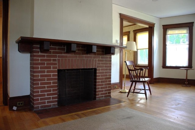 142 College St, Worcester, MA 01610 - detailed view of wood finished floors and a fireplace