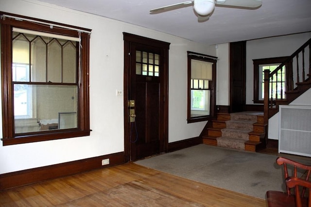 142 College St, Worcester, MA 01610 - entryway featuring stairs, wood finished floors, plenty of natural light, and a ceiling fan