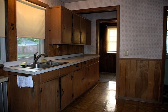 142 College St, Worcester, MA 01610 - kitchen featuring wallpapered walls, wainscoting, light countertops, and wood walls