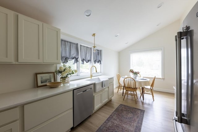 99 Dartmouth St, Westfield, MA 01085 - kitchen with appliances with stainless steel finishes, a sink, healthy amount of natural light, light countertops, and vaulted ceiling