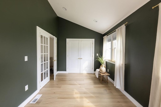 99 Dartmouth St, Westfield, MA 01085 - hallway with french doors, vaulted ceiling, light wood-style flooring, and baseboards