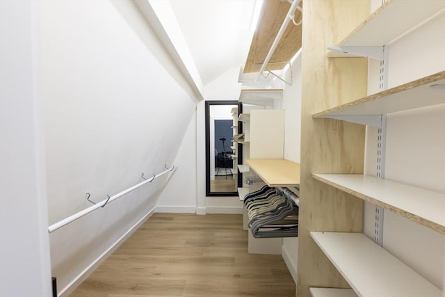 99 Dartmouth St, Westfield, MA 01085 - walk in closet with lofted ceiling and light wood-style floors
