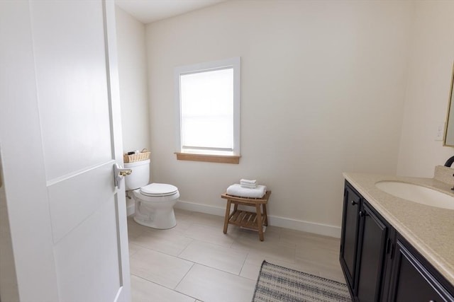 99 Dartmouth St, Westfield, MA 01085 - bathroom with toilet, vanity, tile patterned flooring, and baseboards