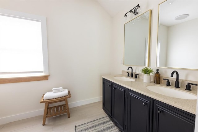 99 Dartmouth St, Westfield, MA 01085 - full bathroom featuring double vanity, baseboards, vaulted ceiling, and tile patterned floors
