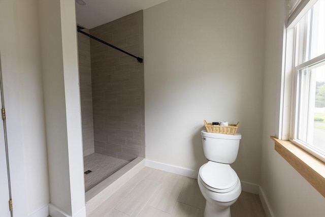 99 Dartmouth St, Westfield, MA 01085 - bathroom featuring toilet, a tile shower, and baseboards