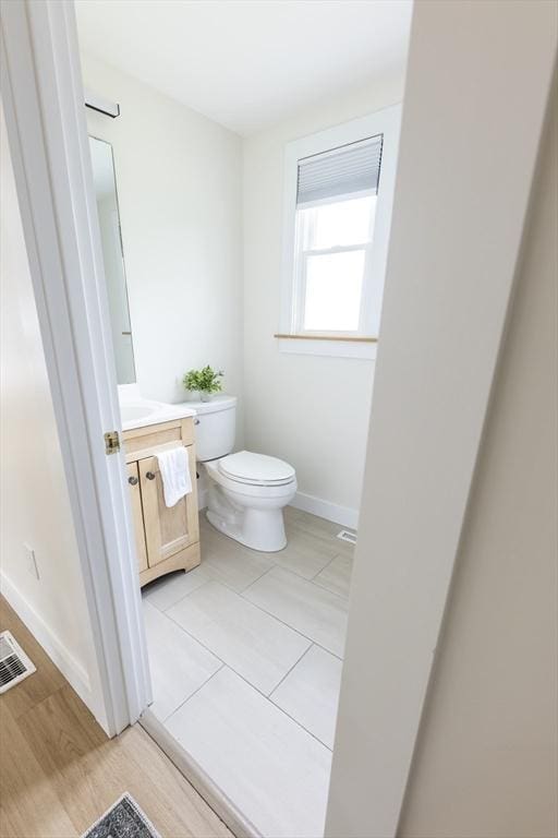 99 Dartmouth St, Westfield, MA 01085 - bathroom with vanity, toilet, and baseboards