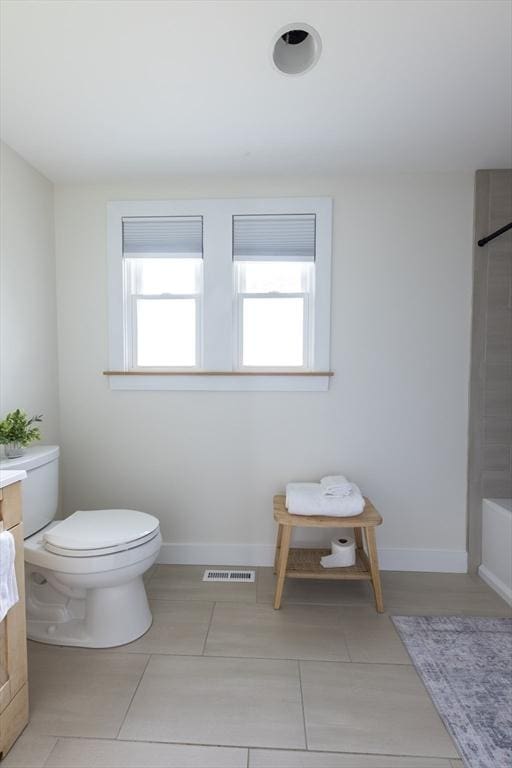 99 Dartmouth St, Westfield, MA 01085 - full bath featuring toilet, plenty of natural light, vanity, and tile patterned flooring