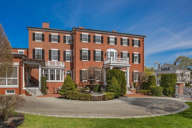 26 Winter St, Salem, MA 01970 - view of front of house featuring a chimney and brick siding
