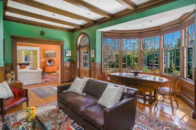 26 Winter St, Salem, MA 01970 - living room with wood finished floors, ornamental molding, wainscoting, and beam ceiling