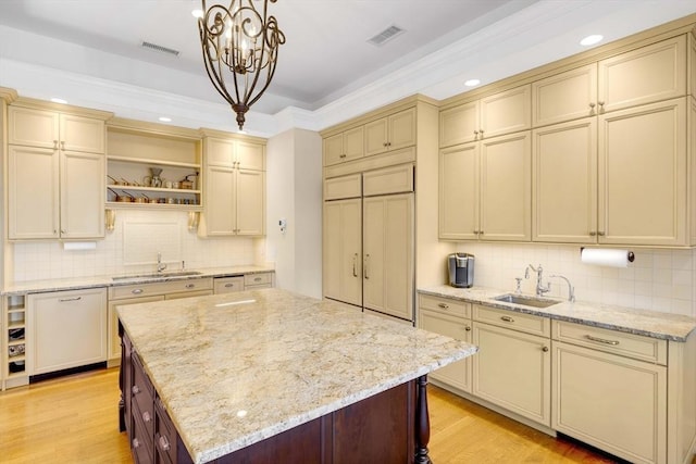 26 Winter St, Salem, MA 01970 - kitchen with cream cabinets, a sink, open shelves, and recessed lighting