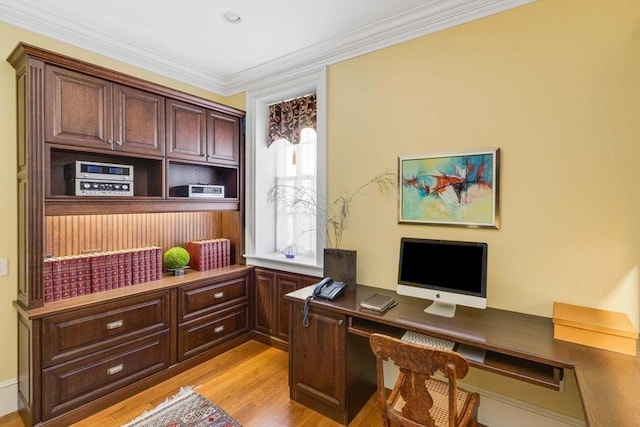 26 Winter St, Salem, MA 01970 - home office featuring light wood-type flooring, ornamental molding, and built in desk