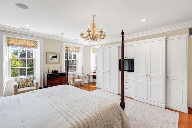 26 Winter St, Salem, MA 01970 - bedroom with crown molding, a chandelier, multiple closets, light wood-style flooring, and recessed lighting