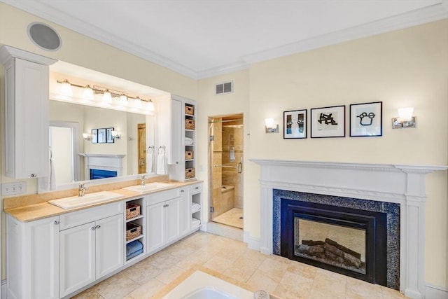 26 Winter St, Salem, MA 01970 - full bath featuring a fireplace, crown molding, a stall shower, double vanity, and a bathtub