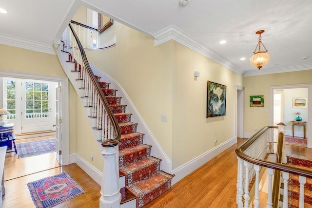 26 Winter St, Salem, MA 01970 - stairway with wood finished floors, ornamental molding, recessed lighting, baseboards, and a chandelier