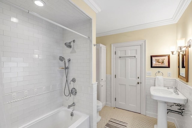 26 Winter St, Salem, MA 01970 - full bathroom featuring crown molding, toilet, tile walls, washtub / shower combination, and a wainscoted wall