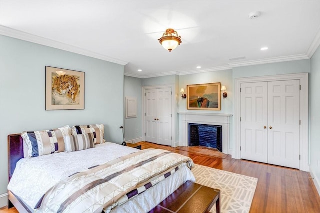 26 Winter St, Salem, MA 01970 - bedroom with wood finished floors, recessed lighting, ornamental molding, a fireplace, and baseboards